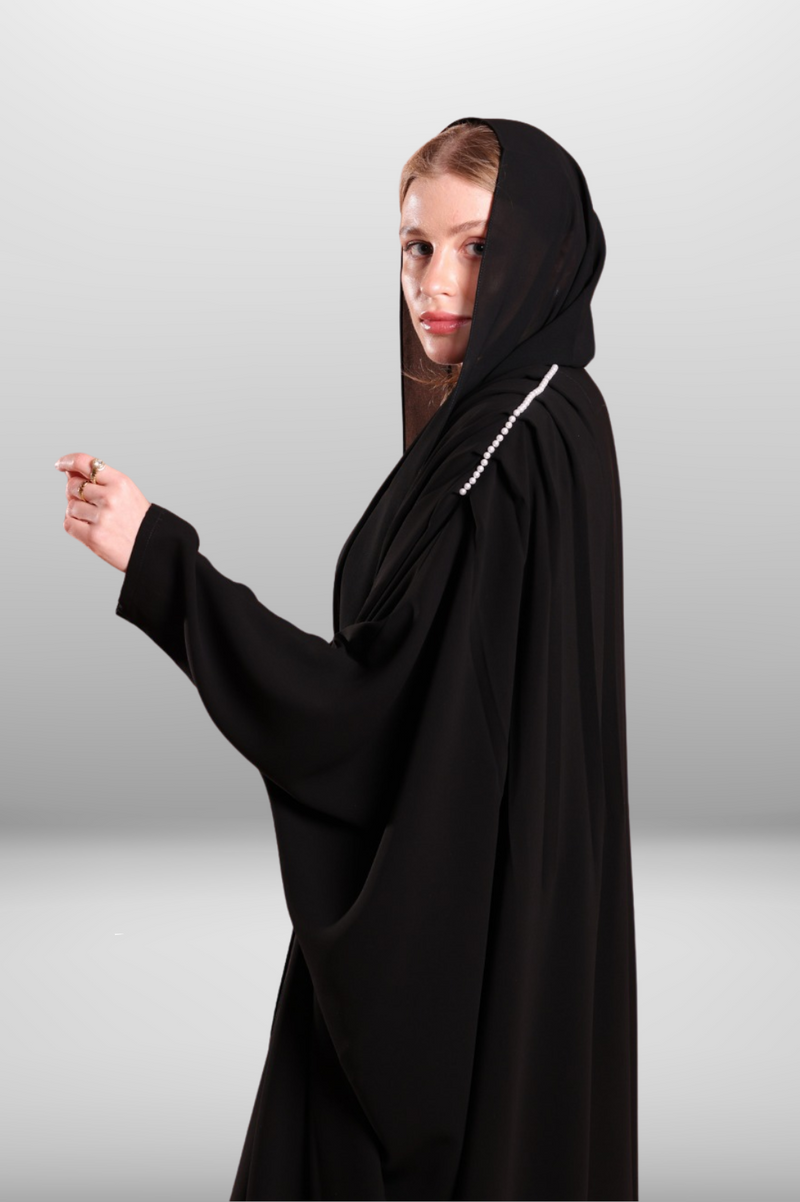 Soft premium fabric abaya with an elegant drape, offering a graceful and sophisticated look.