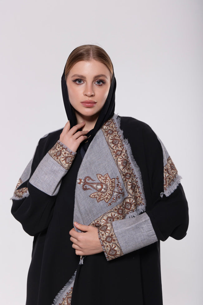Shawl-inspired patchwork abaya made from soft and flowy premium material, blending traditional and modern elements.