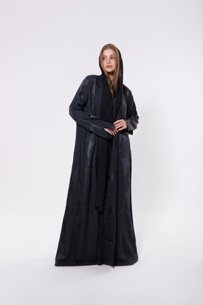Deep black or navy abaya with mixed matte and glossy finishes, crafted from dual-textured premium material for a sophisticated look.