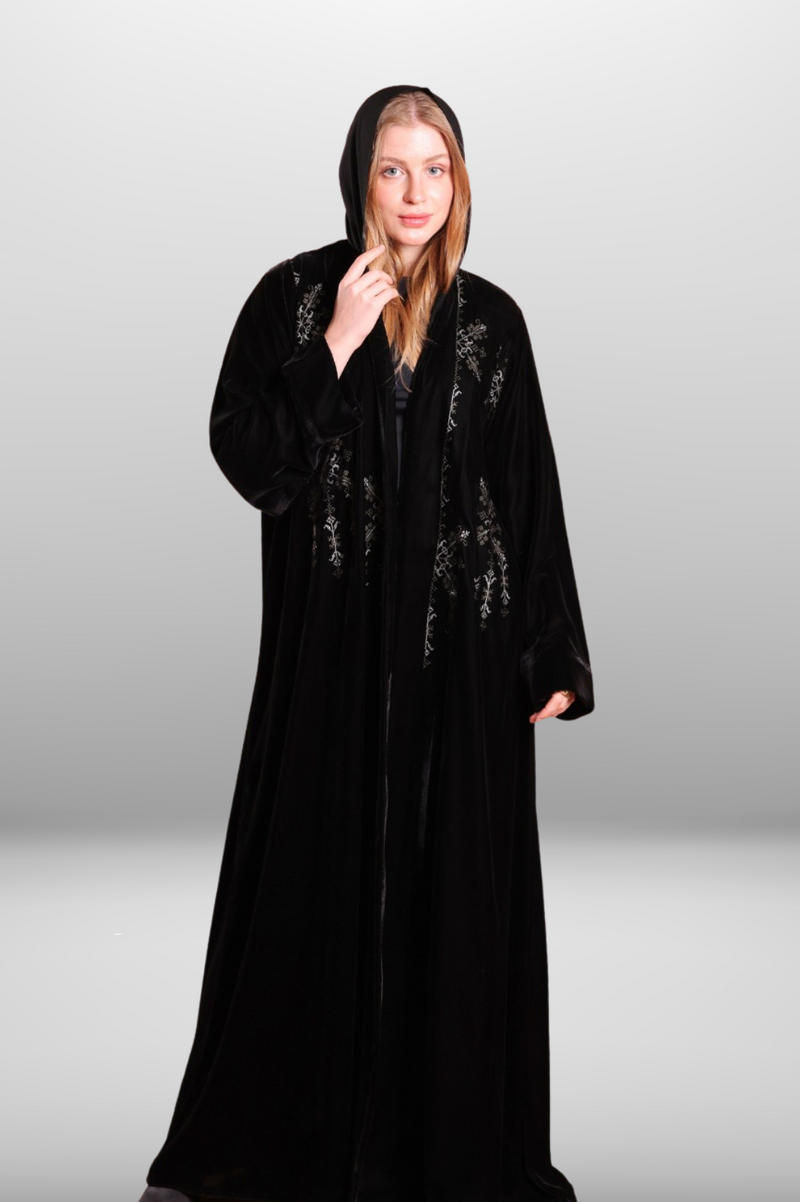 Deep black abaya with intricate embroidered detailing, showcasing luxurious velvet fabric and traditional craftsmanship.