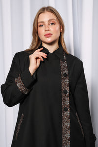 Chic Collared abaya styled open showcasing layered modest fashion look