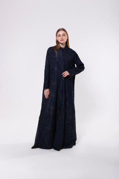 Navy abaya with gold embellishments, made from rich, flowy fabric with a soft gleam, exuding elegance and luxury.
