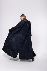Navy abaya with gold embellishments, made from rich, flowy fabric with a soft gleam, exuding elegance and luxury.