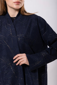 Navy abaya with gold embellishments, made from rich, flowy fabric with a soft gleam, exuding elegance and luxury.