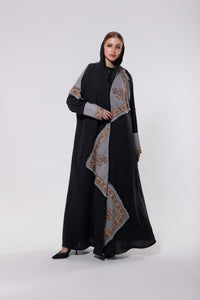 Shawl-inspired patchwork abaya made from soft and flowy premium material, blending traditional and modern elements.