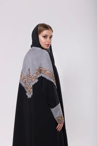 Shawl-inspired patchwork abaya made from soft and flowy premium material, blending traditional and modern elements.