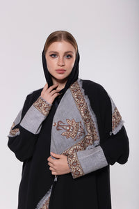 Shawl-inspired patchwork abaya made from soft and flowy premium material, blending traditional and modern elements.