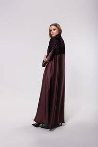 Deep maroon abaya made from a velvet and silk blend, featuring a flowing, luxurious silhouette for an elegant look.