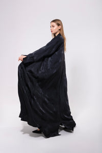 Deep black or navy abaya with mixed matte and glossy finishes, crafted from dual-textured premium material for a sophisticated look.