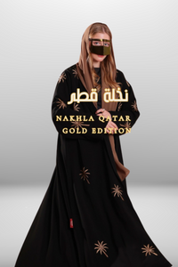 Black abaya with intricate gold embroidery featuring a palm tree motif in golden thread, exuding elegance and luxury.