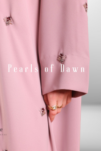 Soft blush pink abaya made from lightweight premium fabric, offering a delicate and elegant silhouette.