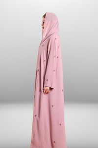 Soft blush pink abaya made from lightweight premium fabric, offering a delicate and elegant silhouette.