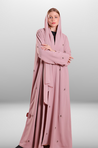 Soft blush pink abaya made from lightweight premium fabric, offering a delicate and elegant silhouette.