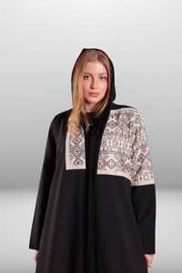 Premium black abaya with beige embroidered panel, combining luxurious fabric with intricate detailing for a refined look.