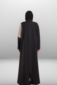 Premium black abaya with beige embroidered panel, combining luxurious fabric with intricate detailing for a refined look.