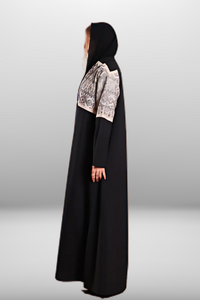 Premium black abaya with beige embroidered panel, combining luxurious fabric with intricate detailing for a refined look.
