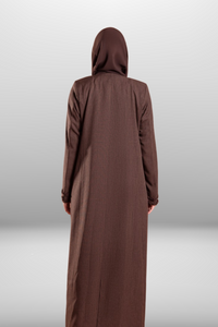 Deep brown coat-style abaya with front buttons, side pockets, and hand-embroidered detailing for a refined and stylish look.