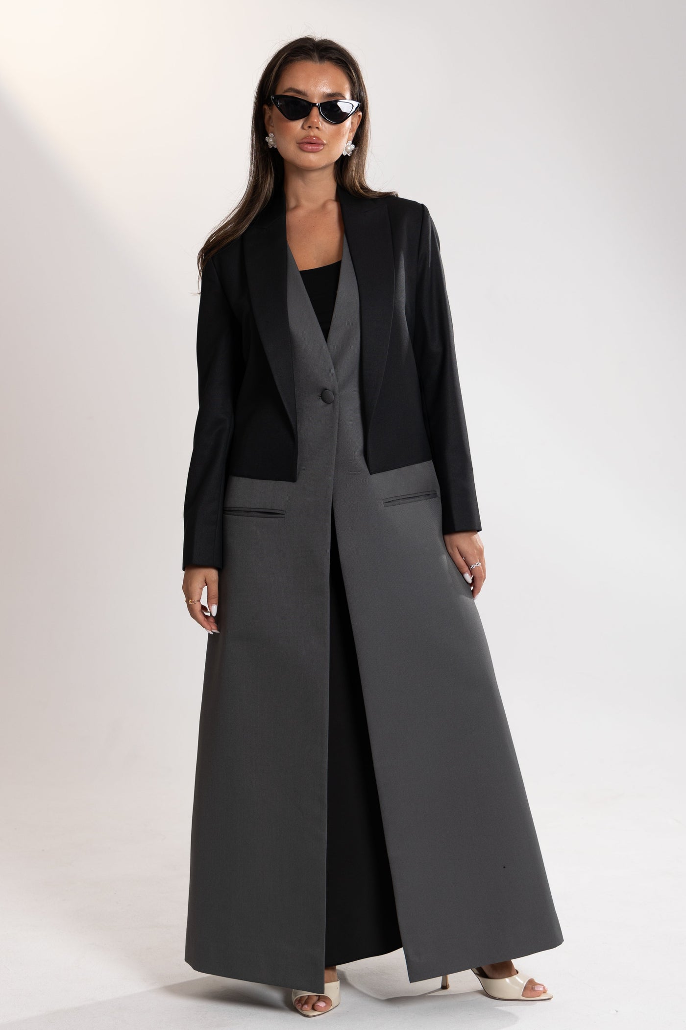Woman wearing a black and gray blazer by esme abaya qatar