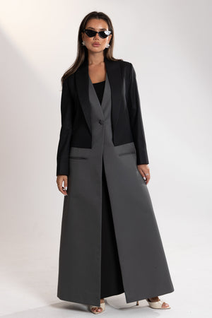 Woman wearing a black and gray blazer by esme abaya qatar