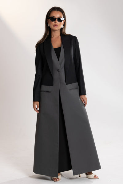 Woman wearing a black and gray blazer by esme abaya qatar