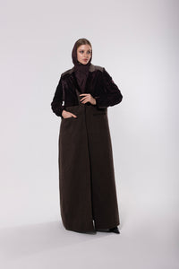 Deep brown abaya crafted from soft, premium velvet, offering a rich and luxurious look with a graceful silhouette.