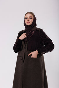 Deep brown abaya crafted from soft, premium velvet, offering a rich and luxurious look with a graceful silhouette.