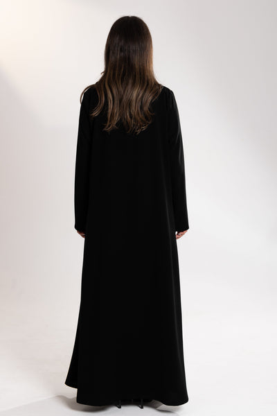 back shot of Woman wearing Esme embroidered Abaya from qatar