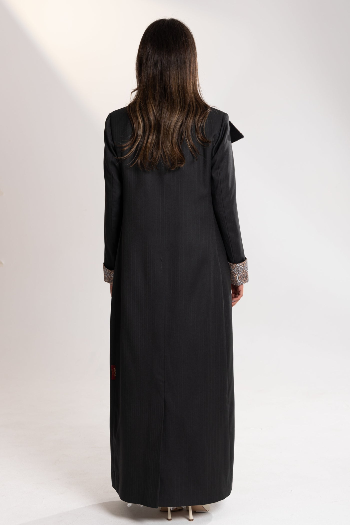 Person wearing a long blazer  from esme qatar back view