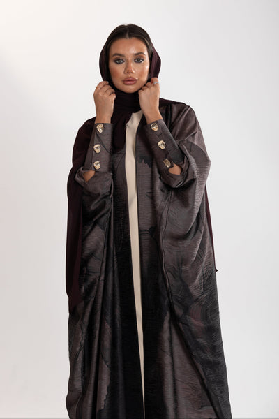 golden button details of ark bisht abaya by esme abaya doha