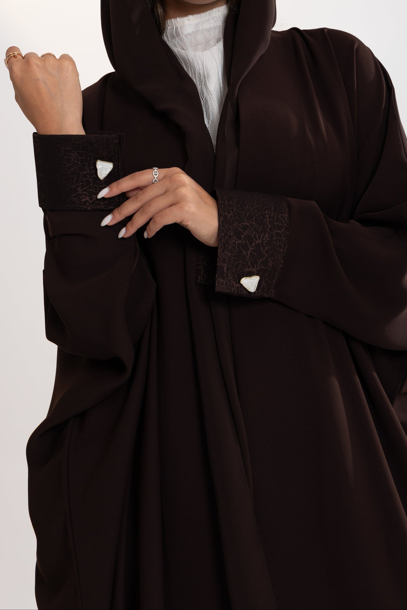 unique sleeves details of esme bisht abaya with white buttons 