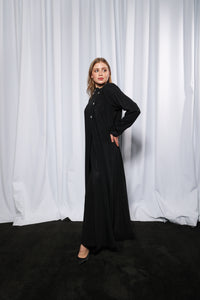 Back view of Bow Charm abaya displaying smooth finish and modest design