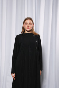 Close up of bow detail on Bow Charm abaya showing refined stitching and design finish