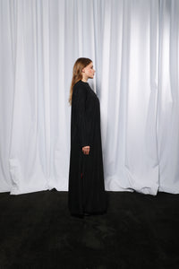 Side profile of Bow Charm abaya highlighting clean cut and soft drape