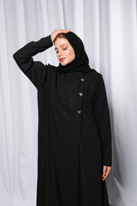 Bow Charm abaya in motion showing flowy silhouette and refined bow feature