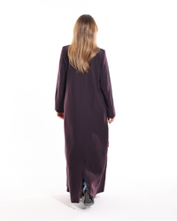 Close-up of the functional pocket with elegant golden button detailing on the Dark Purple Abaya by Esmeabaya.