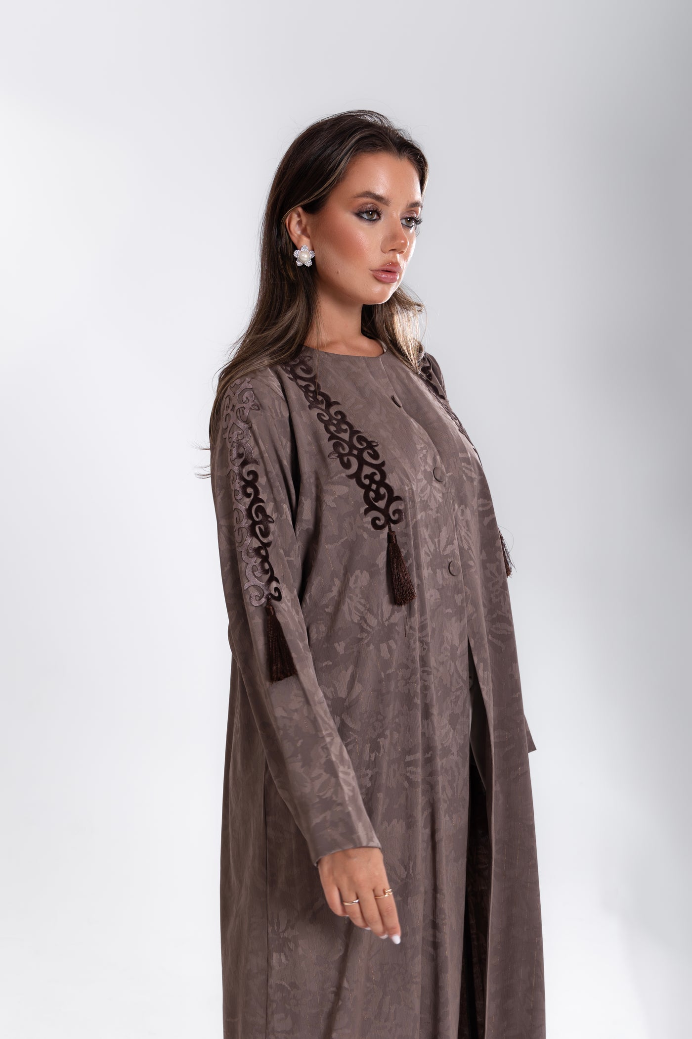 Soft beige abaya with velvet tassels from Esme Abaya, Doha winter style