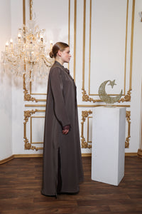 Side profile of Esmeabaya Lace Abaya Legacy highlighting delicate lacework and structured fit