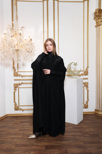 Back view of Esmeabaya Nova Cape showcasing elegant fall and refined finishing