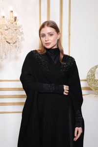 Shoulder detail of Esmeabaya Nova Cape highlighting sleek cape cut and premium tailoring