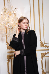 Fabric texture of Esmeabaya Royal Nakhla Abaya in smooth high-quality material