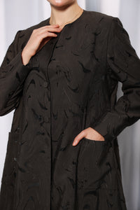 Side profile of Esmeabaya Soft Olive Abaya highlighting structured modest fit