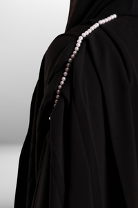 Soft premium fabric abaya with an elegant drape, offering a graceful and sophisticated look.