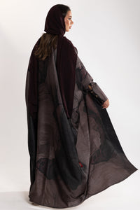 beautiful flowy fabric details of dark bisht abaya by esme abaya qatar