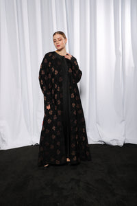 Side profile of Flared Everyday abaya highlighting flowing flare and relaxed fit