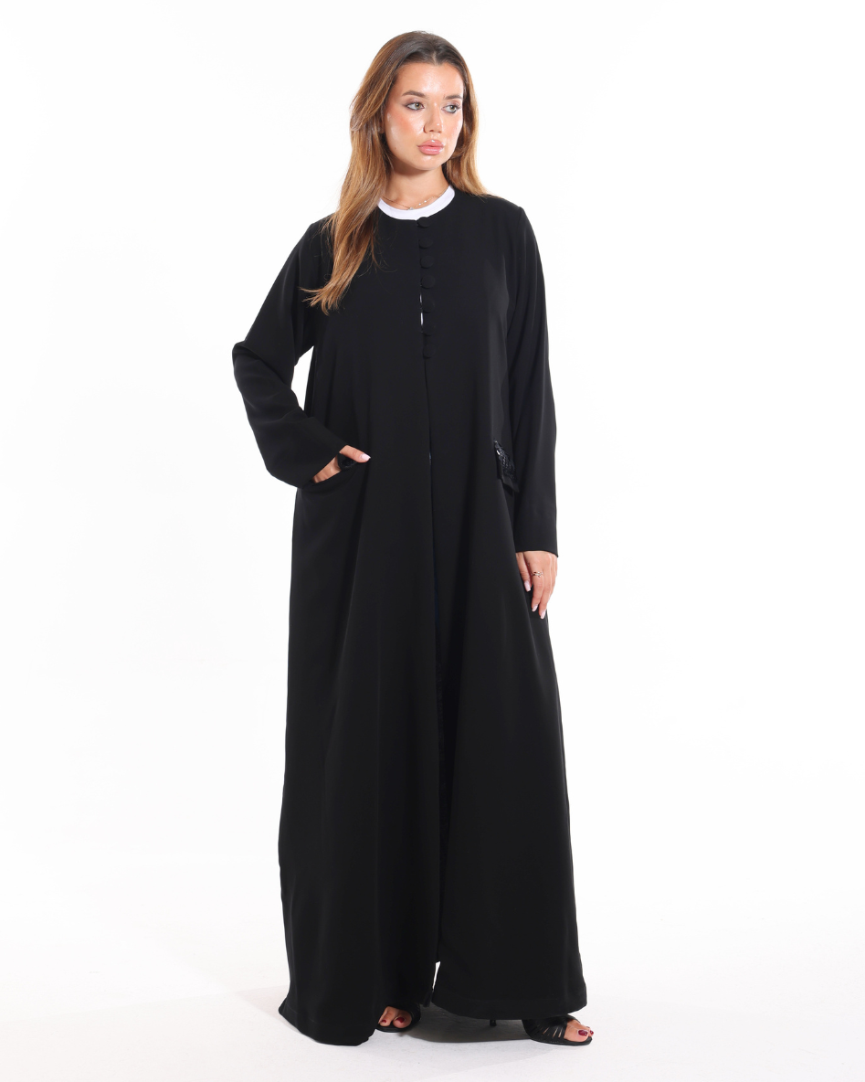 Glow Pocket Abaya Black front view featuring six front buttons, lace pockets, and a luxury modest silhouette by Esmeabaya.