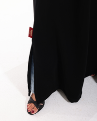 Close-up of the lace pocket detailing and premium craftsmanship on the Glow Pocket Abaya Black by Esmeabaya.
