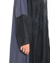 Close-up view of Graphite Grace abaya showcasing refined fabric details and premium craftsmanship by Esme Abaya.