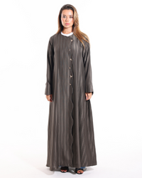 Heart of Gold abaya from Esme Abaya Summer '26 collection featuring elegant golden details and a luxurious modest fashion design.