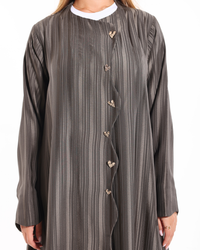 Close-up view of Heart of Gold abaya showcasing delicate golden embroidery and premium craftsmanship by Esme Abaya.