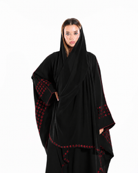 Side profile of Love Notes Bisht Black Variant highlighting graceful drape, embroidered heart detailing, and flowing bisht silhouette.